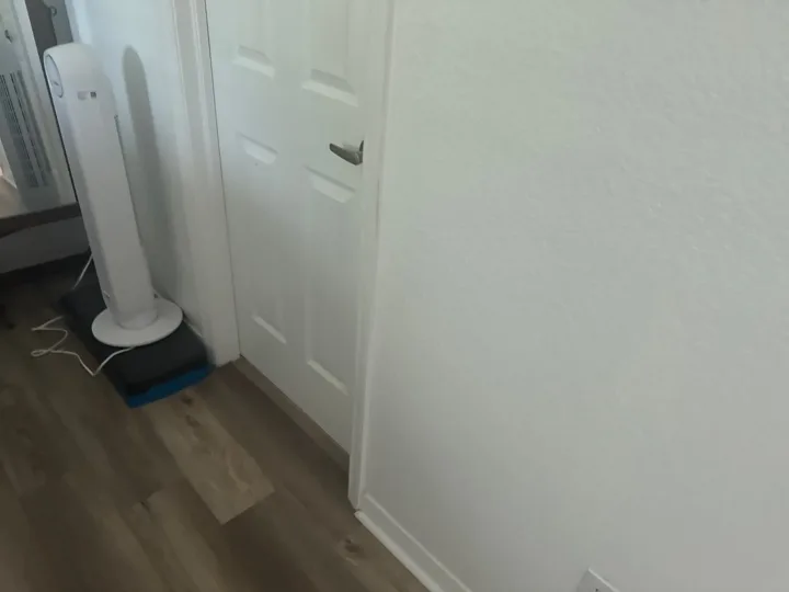 Portable equipment positioned beside an interior doorway.